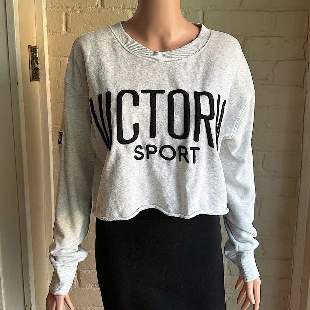 Victoria’s Secret size medium cream and black long sleeve crop top sweatshirt